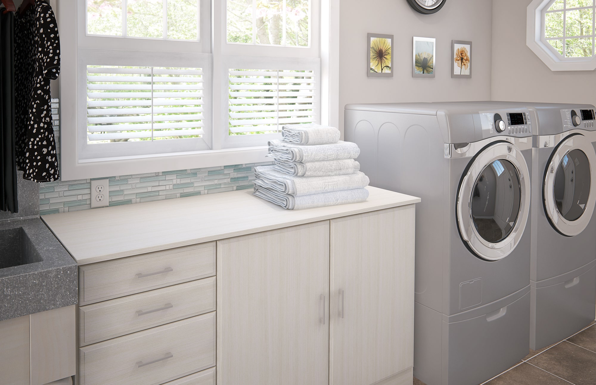 Custom laundry room with folding counter and cabinets in Auburn Alabama